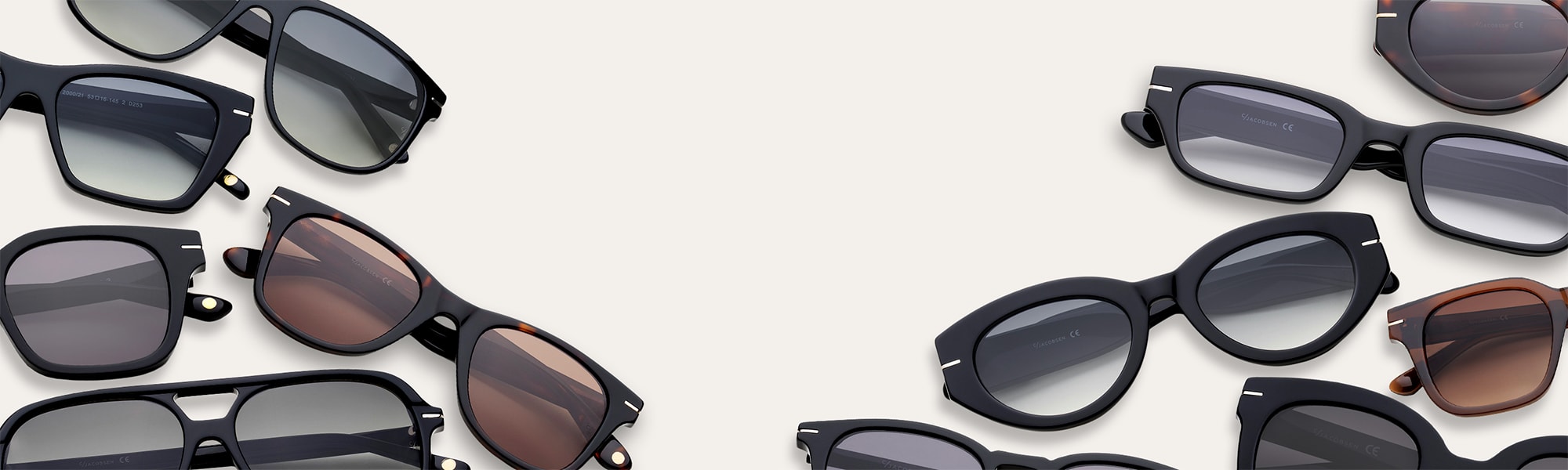 Eri tyylisiä ja värisiä aurinkolaseja, kuten ruskeita, tortoise-värisiä ja mustia, vaaleaa taustaa vasten.